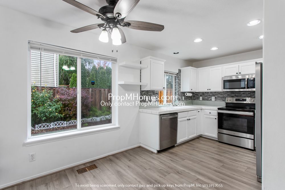 Modern Comforts: Attached Garage & Serene Backyard Deck! property image