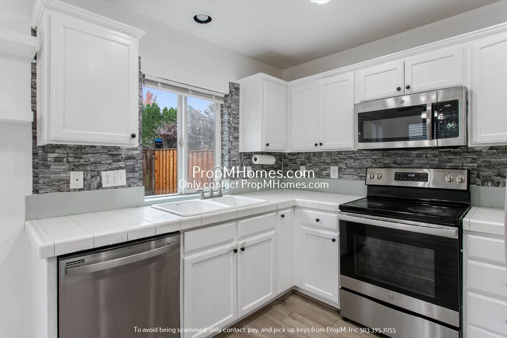 Modern Comforts: Attached Garage & Serene Backyard Deck! property image