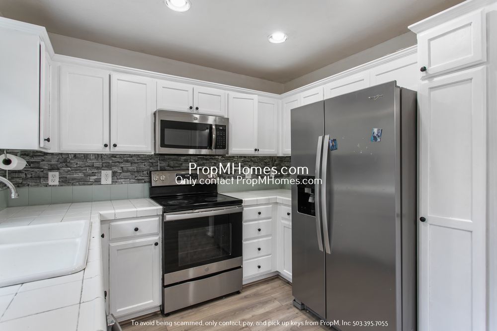 Modern Comforts: Attached Garage & Serene Backyard Deck! property image